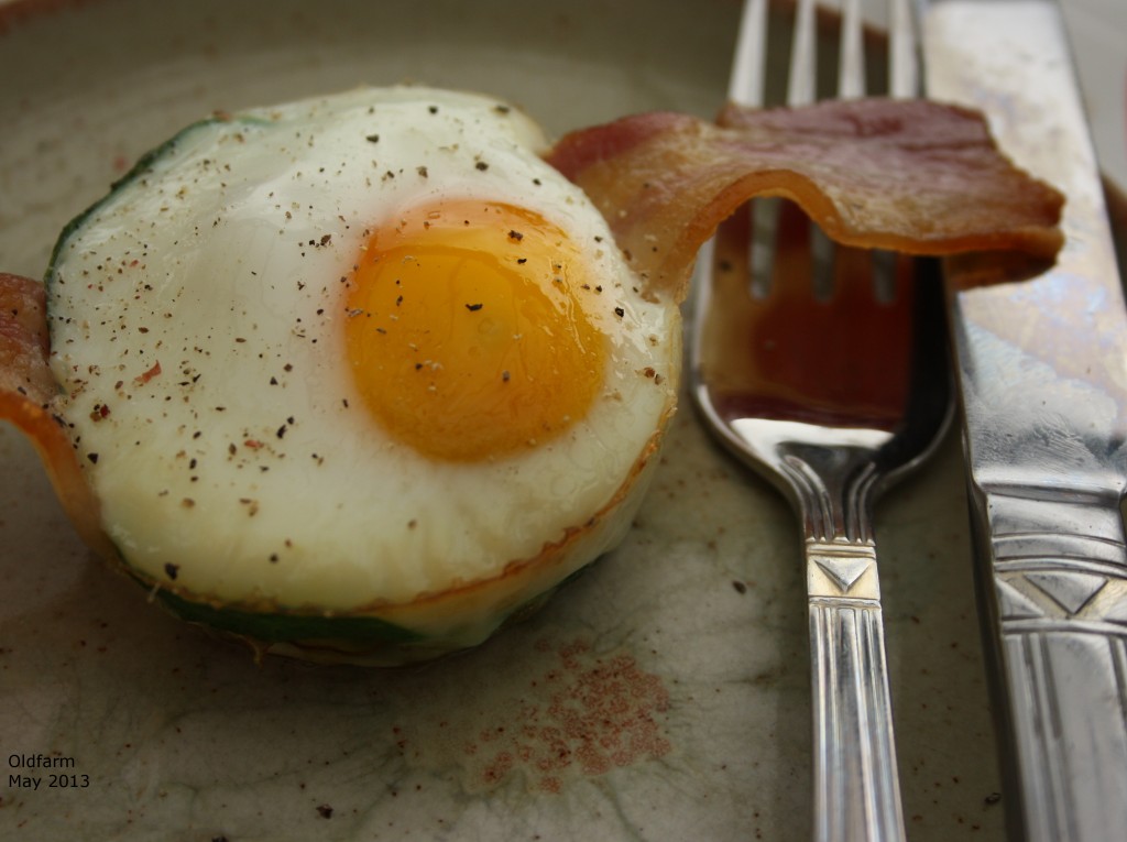 Baked egg, with bacon and sprinkle of black pepper